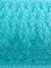 Dantela Couture türkiz geometriai mintával, gyöngyökkel és flitterekkel