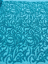 Dantela Couture türkiz geometriai mintával, gyöngyökkel és flitterekkel