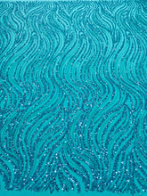 Dantela Couture türkiz lineáris mintával, gyöngyökkel és flitterekkel